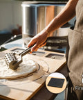 Person using a Large Bamboo Cutting Board With 3 Shatter Resistant Containers And Lids For Kitchen Prep, featuring anti slip rubber feet