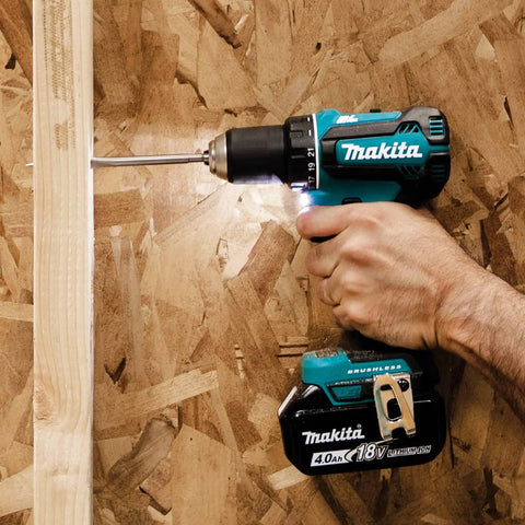 Person using Beast 18V Brushless 1/2 Inch Driver Drill Cordless Kit With Two Speed Transmission on wooden surface
