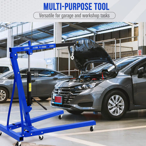 Badass 2 Ton Hydraulic Engine Hoist With Telescopic Boom And Six Heavy Duty Swivel Casters For Easy Motor Swaps in workshop.