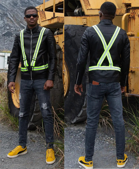 Man wearing high visibility reflective running vest pack of 10 neon yellow lightweight adjustable with reflective strips outdoors.