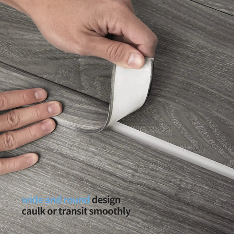 Peel And Stick Self Adhesive Vinyl Strip For Floor Gaps And Carpet Thresholds 10 Feet Long 1.57 Inches Wide Gray Durable PVC Transition Strip Scratches Dirt Resistant Easy To Clean being applied