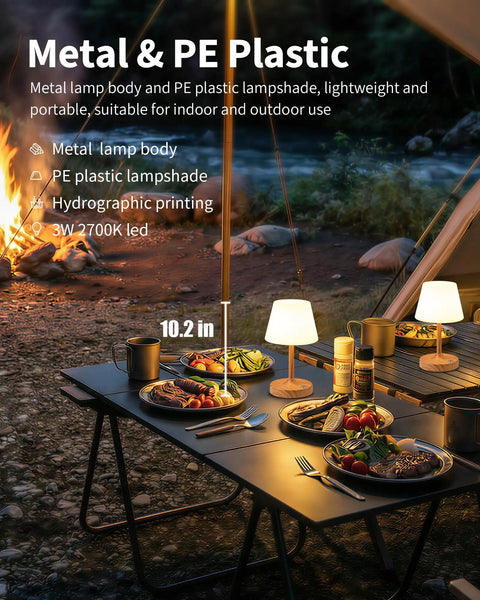 Outdoor dining scene with Cordless LED Wood-Grain Table Lamp With Waterproof Shower Design, illuminating a campsite table.