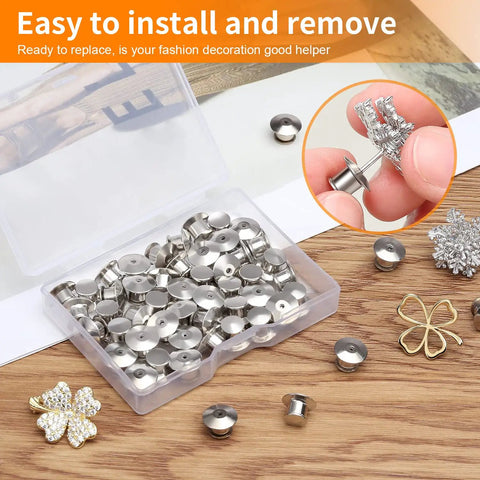 Hella Secure 30 Pack Locking Pin Backs For Sewing Needles, Nickel Plated Copper Clasp Keepers in storage box on wooden table.