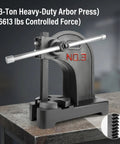 Heavy Duty Cast Iron Arbor Press With Steel Anvil For Center Punch And Ring Making, 3-ton industrial press on workbench.