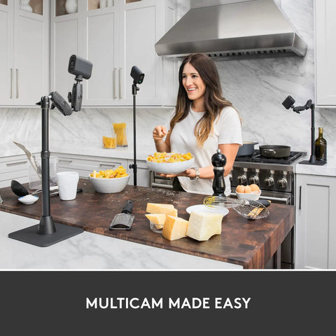 Mevo Start Wireless Streaming Cam With Legit 1080P HD Clarity in kitchen setup with vlogger preparing pasta dish.