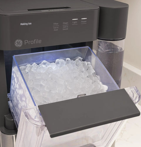 No Cap Portable Nugget Ice Maker Countertop Machine Produces Chewy Pebble Ice Built To Hit Different with ice bin filled with nugget ice.