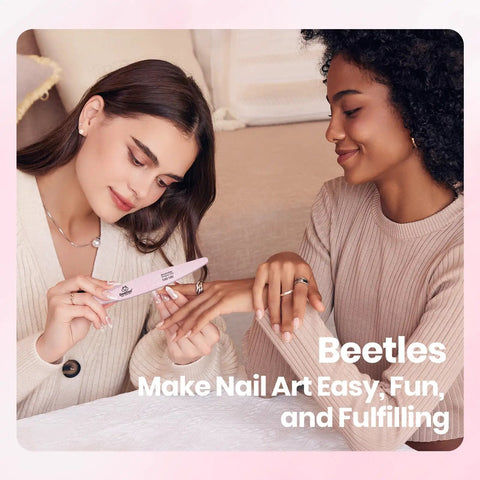 Two women using HEMA Free Pink Gel Nail Kit With UV Light Travel Set 5 Piece for a home manicure on a beige sofa.