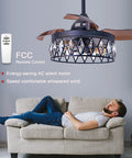 36 Inch Matte Black Crystal Ceiling Fan With Light And Remote displayed over a couch in a modern living room