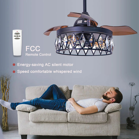 36 Inch Matte Black Crystal Ceiling Fan With Light And Remote displayed over a couch in a modern living room