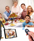 Alt Tag: Family dinner being captured with a Two Pack Wireless Phone Camera Remote Shutter for iPhone and Android with wrist strap.