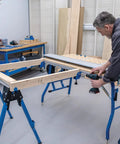 Man using a drill on adaptive cutting system extension brackets on a workbench. Level Up Your Shop Rig With These Knockout Adaptive Cutting System Extension Brackets That Bolt Right Onto Standard Workbenches Or Portable Project Tables For Quick Setup.