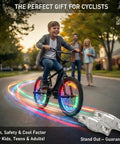 Child riding bike with Rechargeable 9 Color LED Bicycle Spoke Lights With 21 Modes And Motion Sensor Auto On Off, glowing wheels.
