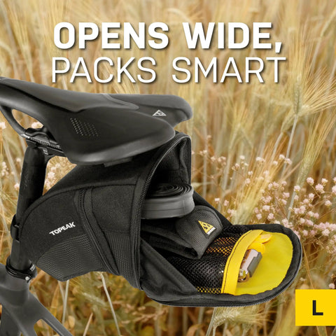 Aero Wedge Pack With Fixer F25 Large for Road and Mountain Bikes, open storage showing weather resistant gear storage.