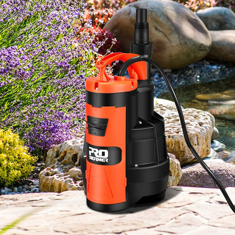 Beast Mode Heavy Duty 1HP Sump Pump With 3500GPH Flow for Pools, Ponds, and Basements, on rocks beside a pond backdrop.