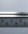 10K Ohm Slide Potentiometer With 100mm Travel, Single Linear Taper, Carbon Metal Housing, 15mm Lever next to ruler
