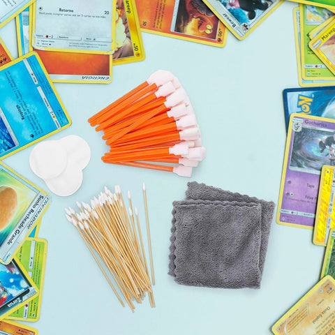 Foam cleaning swabs with white tips (orange sticks), 50 pcs for electronics; gray microfiber cloth visible.