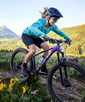 Mountain biker on a trail, featuring 130 Degree Adjustable Dialed In Bicycle Stem With 75mm 90mm And 130mm Options For 31.8mm Handlebars