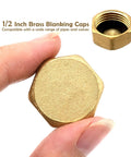 Two Pack Half Inch Brass Blanking Caps With Gasket, female thread nut caps for plumbing fittings and valves, shown in hand