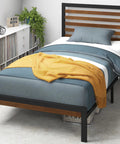 Solid Bamboo And Steel Platform Bed Frame With Sleek Headboard In Toasty Brown Twin Size with blue bedding and yellow throw.