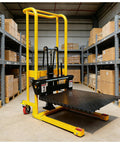 Yellow hydraulic material lift stacker with black lifting mechanism and removable diamond-plate platform