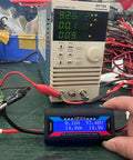 Badass No Sweat Plug And Play 200A Digital Wattmeter measuring volts and amps in a workshop with electronic load.