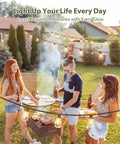 Group enjoying barbecue under 96 Ft Outdoor Solar String Lights With Remote And USB Port, Waterproof Patio Garden Lights