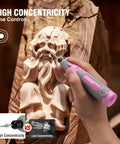 Person using Cordless Rotary Tool Kit With 71-Piece Accessory Set, 3 Speeds, USB Rechargeable Mini Rotary Tool For Engraving, Sanding, Polishing, Carving, Cutting, And DIY Crafts - Pink Ribbon on wood carving