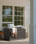 98 Gallon Waterproof Resin Deck Box With Cushion Lockable Outdoor Storage Bench in deep brown on a patio.