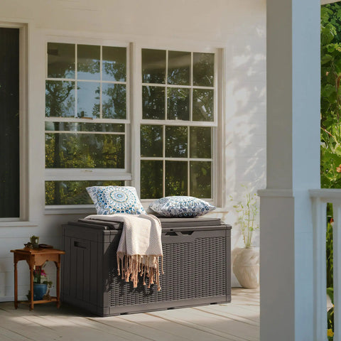 98 Gallon Waterproof Resin Deck Box With Cushion Lockable Outdoor Storage Bench in deep brown on a patio.