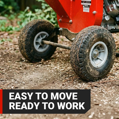 Ultra Duty 7 HP Gas Powered Wood Chipper Shredder Mulcher with reinforced wheels on dirt, easy to move