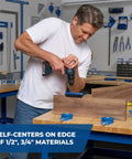 Kreg portable drilling guide with six hardened drill guides in use on wood by a craftsman with a cordless drill.
