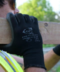 Worker wearing PUG17 Lightweight Polyurethane Dipped Work Gloves With Anti Static And Dope Grip for Bare Hand Sensitivity holding a beam