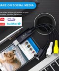 USB 2 Point 0 Video Capture Card For Streaming And VHS To Digital Conversion shown with cables on desk near phone and laptop.