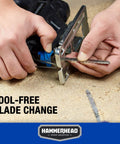Hammerhead 4.8-Amp jig saw, blue housing, close-up of tool-free blade change with two wood blades