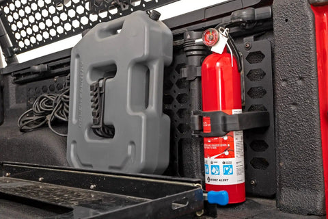 Weather Resistant Rubber Molle Panel Adjustable Clamp Kit holding fire extinguisher and gear in off-road vehicle