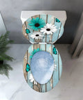 Toilet Seat Elongated Quiet-Close for Farmhouse Use with floral design and butterfly details on a blue wood background.