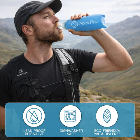 Person wearing lightweight hydration running vest for men and women with 9 pockets and drinking from 500ml soft flask.