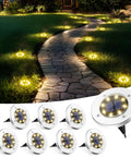 8 Pack Outdoor Solar Ground Lights illuminating pathway with warm white glow, ideal for pathways, driveways, and garden borders.