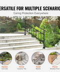 Rock Solid Wrought Iron Outdoor Stair Railing With Adjustable Frame For Zero To Five Steps Sleek Matte Black Finish shown on exterior garden steps.