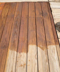 Heavy Duty Water Based Deck Stain And Sealer In One Semi Transparent Wood Finish For Outdoor Decks showing application on wooden surface.