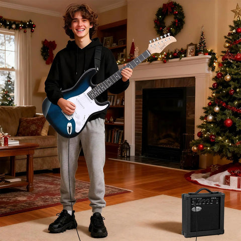 Teen playing 39 Inch Full Size Electric Guitar Starter Pack With Amp Nylon Carrying Case and Accessory Kit Blue for Beginners Ready To Jam Out Of The Box Includes Tuner Cables Straps Extra Strings All Wood Construction Maple Neck in a festive living room.