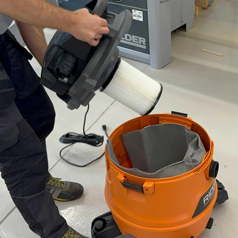 Person emptying Ridgid shop vacuum with Reusable Dust Bag For Ridgid And Craftsman Shop Vacuums, 1 Pack Vacuum Bag And Filter Bag
