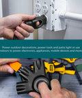EZGrip 25 Ft Heavy Duty Outdoor Extension Cord With Multiple Outlets in use, showing ergonomic grip and connection to power tool