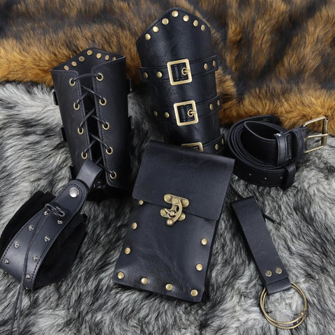 Badass Renaissance Belt Pouch Set With Detachable Corset Strap Soft Leather Bracers Vintage Coin Purse And Utility Hook Strap For Ren Faire Larp Gear That Legit Slaps At The Fair displayed on a fur background, showcasing black leather bracers and pouch.