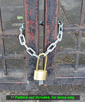 Tough As Nails Cut Proof Security Chain For Outdoor Gates Fences And Yards crafted from ultra hardened alloy steel securing a gate.