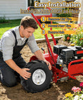 Man installing Heavy Duty Thirteen By Five Inch Rear Tine Tiller Tire And Wheel Set Four Ply Puncture Resistant Construction Three Quarter Inch Axle Bore Replacement For Garden Tiller And Farm Equipment Easy Bolt On Install Two Pack on red garden tiller