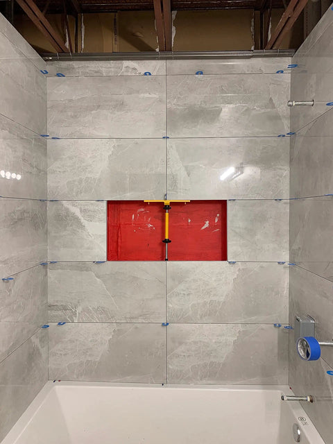 Shower Niche Tiling Tool Kit With Aluminum Support For Ceramic And Porcelain Tile Installations in use, showcasing precise alignment in a bathroom.