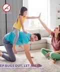 Family playing in living room with Heavy Duty Magnetic Screen Door 72x80 Self Sealing Hands Free Mesh in background.