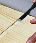 Person using chisel on wood from Beginner Friendly Japanese Woodworking Hand Tool Set 7 Piece Includes Plane Chisels Pull Saw Hammer Marking Gauge And Carry Bag All In One Starter Kit Made In Japan For DIY Woodworking Fans
