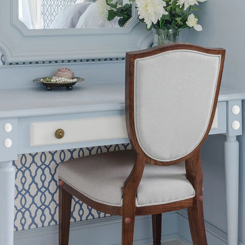 Elegant vanity setup with a wooden chair and blue desk, showcasing 1152 Pcs Self Adhesive Screw Hole Stickers And 120 Pcs Screw Cap Covers Set.